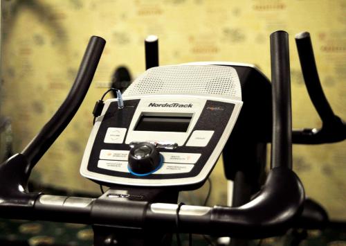 a cell phone sitting on top of a bike at Status Hotel in Lviv