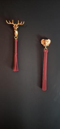 two vases are hanging on a wall at Love Room AMeuse&Vous in Hastière-par-delà