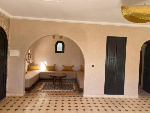 a living room with a couch and a table at Villa AMMA in Essaouira