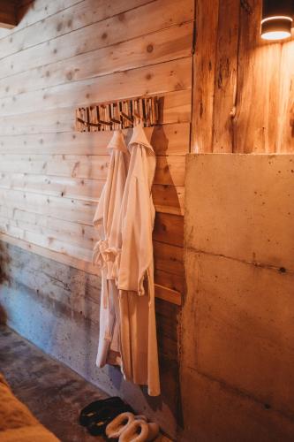 a room with wooden walls and towels hanging on a wall at The Eagle's Roost in Port Angeles