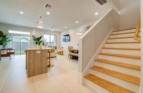 a staircase in a home with a living room at Comfort exceed in this 3 BR premium in Houston! in Houston
