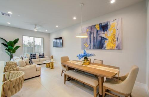 a living room with a dining table and a couch at Comfort exceed in this 3 BR premium in Houston! in Houston