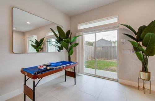 a blue ping pong table in a room with a mirror at Comfort exceed in this 3 BR premium in Houston! in Houston