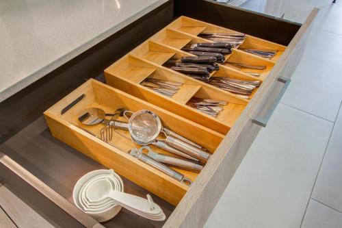 a drawer full of utensils in a kitchen at Comfort exceed in this 3 BR premium in Houston! in Houston
