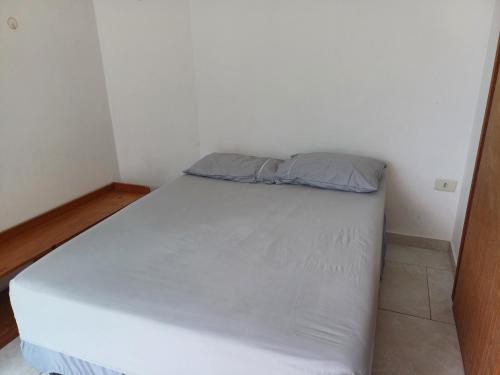 Ένα ή περισσότερα κρεβάτια σε δωμάτιο στο Cobertura praia de leste