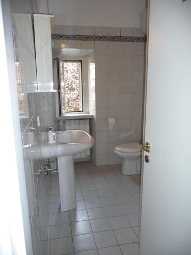 a bathroom with a sink and a toilet at Hotel La Toscana in Arezzo