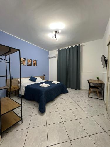 Ένα ή περισσότερα κρεβάτια σε δωμάτιο στο In Riva al Mare