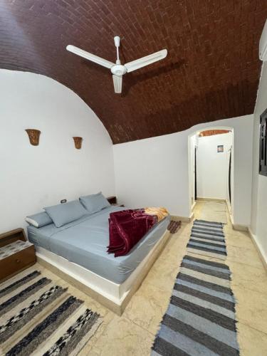 Postel nebo postele na pokoji v ubytování king kassem nubian guest house
