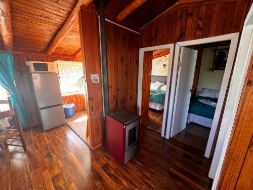 Postel nebo postele na pokoji v ubytování Cabañas y Hostal Isla Mágica