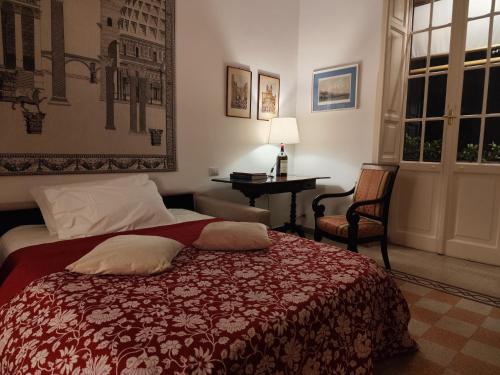 a bedroom with a bed and a desk and windows at Have a nice stay in Rome 2 in Rome