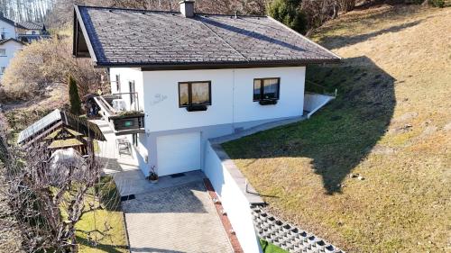 an aerial view of a white house at Ferienhaus Ursula Velden in Velden am Wörthersee