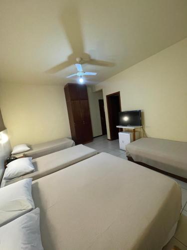 Postel nebo postele na pokoji v ubytování Hotel Cambirela