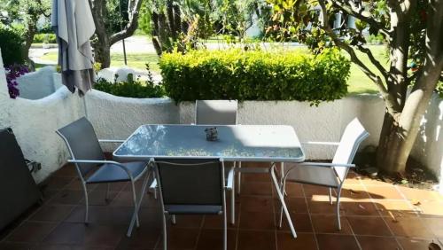 a table and chairs sitting on a patio at Spacious House in Calafell with Shared Pool in Calafell
