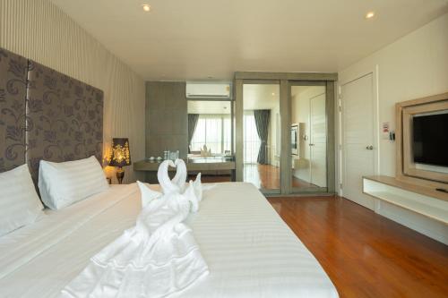 Ένα ή περισσότερα κρεβάτια σε δωμάτιο στο Yenna Apartment