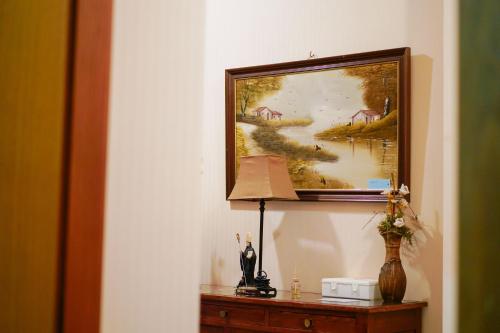 a painting of a painting of a river on a wall at Alojamento Galerias Nascentes in Alijó