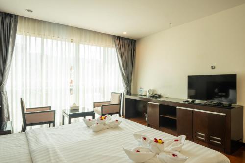 Μια τηλεόραση ή/και κέντρο ψυχαγωγίας στο Yenna Apartment