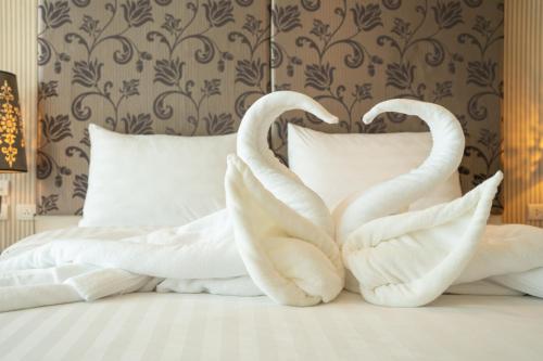 Ένα ή περισσότερα κρεβάτια σε δωμάτιο στο Yenna Apartment