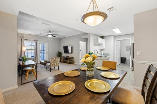 a dining room and living room with a wooden table at Charming 3BR Athens Abode Near UGA and Downtown in Athens