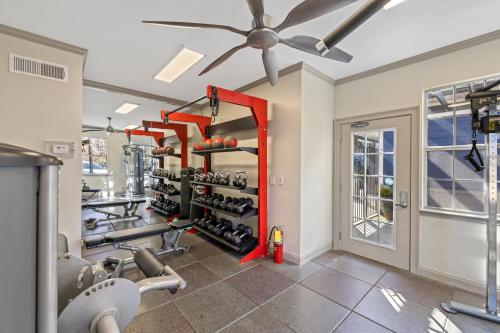 a gym with cardio equipment and a ceiling fan at Charming 3BR Athens Abode Near UGA and Downtown in Athens