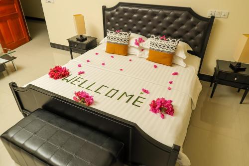 Katil atau katil-katil dalam bilik di Charming Holiday Lodge