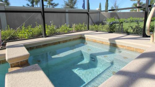 a swimming pool with blue water in a backyard at ACN4308 in Bemidji