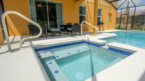 a swimming pool with chairs and a table and a pool at ACN4317 in Bemidji