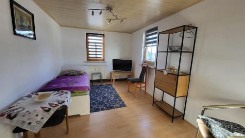 Ένα ή περισσότερα κρεβάτια σε δωμάτιο στο Ferienhaus Deubetal Nr 9