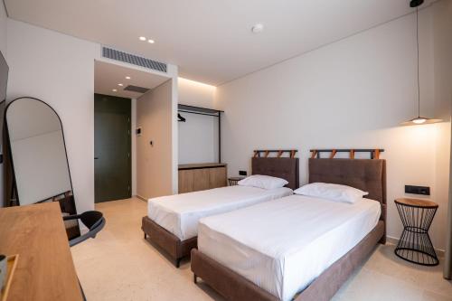 Postel nebo postele na pokoji v ubytování Kamara Rooms