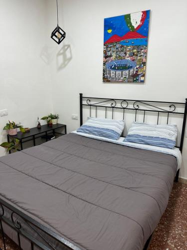 Ένα ή περισσότερα κρεβάτια σε δωμάτιο στο La Residenza di Giovanni a Napoli