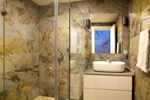 a bathroom with a sink and a shower at Villa Calista by Important Group Travel in Yalıkavak