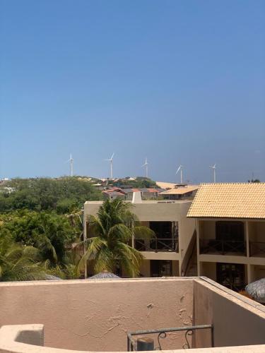 a view from the balcony of a apartment building at Pousada Aruana in Canoa Quebrada