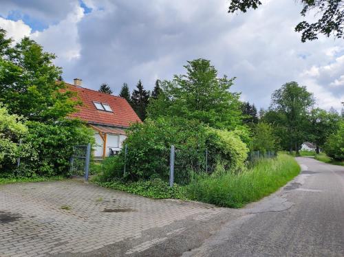 a house on the side of a road at Chata 2 pro dva nebo pro celou rodinu in Slavníč