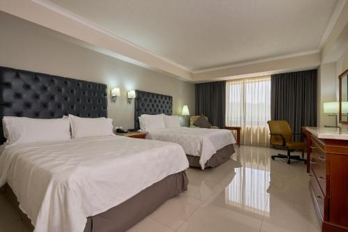 Postel nebo postele na pokoji v ubytování Holiday Inn Tuxtla Gutierrez by IHG