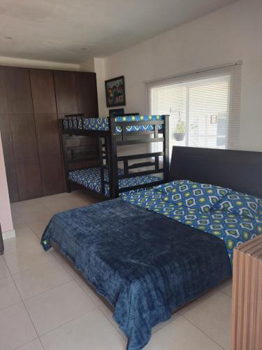 Una cama o camas en una habitación de Villa Layla Santa Marta