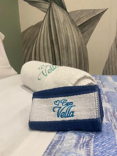 a pile of towels sitting on top of a bed at Casa Vella Apartment in Agrigento