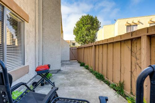 a bike parked next to a fence next to a building at 2 Mi to Beaches Condo with Patio in Port Hueneme! in Port Hueneme