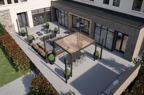 an overhead view of a patio with a table and benches at Staybridge Suites Southaven - Memphis South by IHG in Southaven