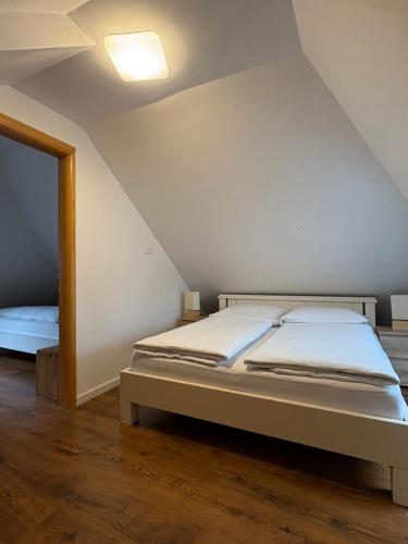 a bedroom with a bed and a mirror at Esos Hotel Quelle in Bad Ragaz
