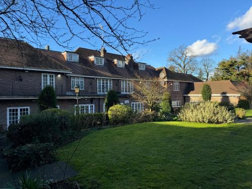 a house with a lawn in front of it at The Bishop in London