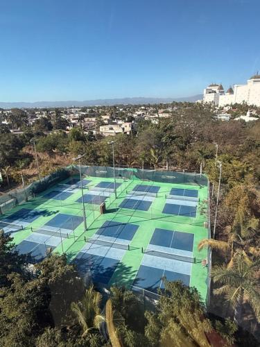 an overhead view of a tennis court with solar panels at Luxurious 2 Bedroom Upscale Condo in Nuevo Vallarta 