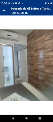a picture of a room with a bathroom with a mirror at Pousada Café Villa Monnaié in Chapada dos Guimarães