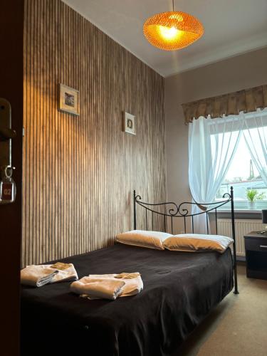 Ένα ή περισσότερα κρεβάτια σε δωμάτιο στο Hotel Chrobry