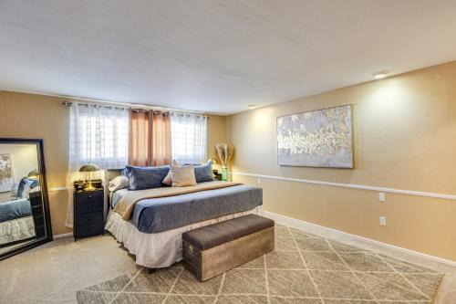 a bedroom with a bed and a large window at Private Pool & Fire Pit! Walkable Tucson Retreat in Tucson