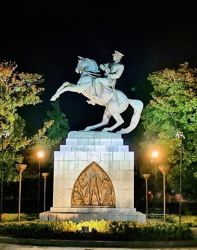 a statue of a man riding a horse at night at Samlife Apart in Samsun