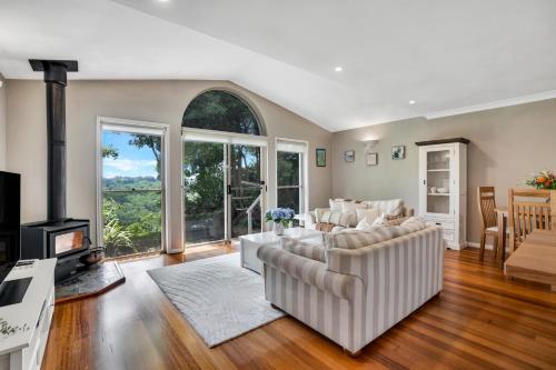 a living room with two couches and a fireplace at The Avenue at Montville Cottage in Montville