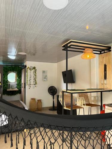 a living room with a table and a dining room at Refugio verde, interior 2 in Acacías
