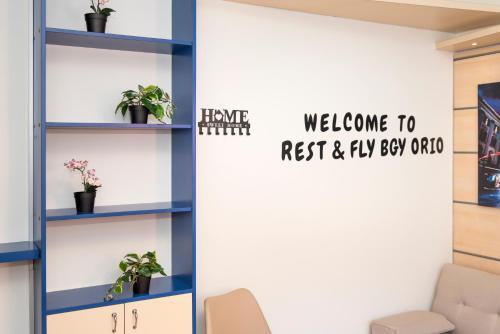 a room with blue shelves and a door with welcome to rest and fly egg office at rest&fly BGY ORIO in Grassobbio