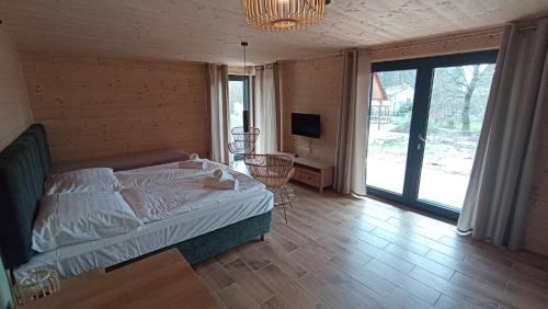 Postel nebo postele na pokoji v ubytování Glamping Challet Slunečno Český ráj