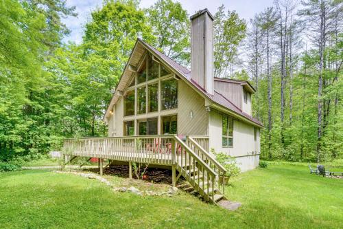 a small house with a large porch on a lawn at Family-Friendly Ludlow Cabin on Lake Pauline! in Ludlow