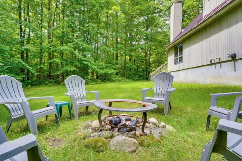 a group of chairs sitting around a fire pit at Family-Friendly Ludlow Cabin on Lake Pauline! in Ludlow